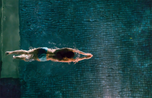 woman swimming in salt water pool