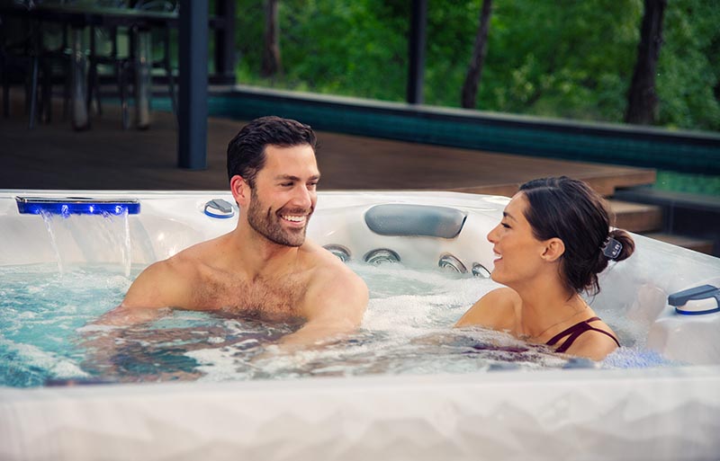 Couple enjoying a hot tub